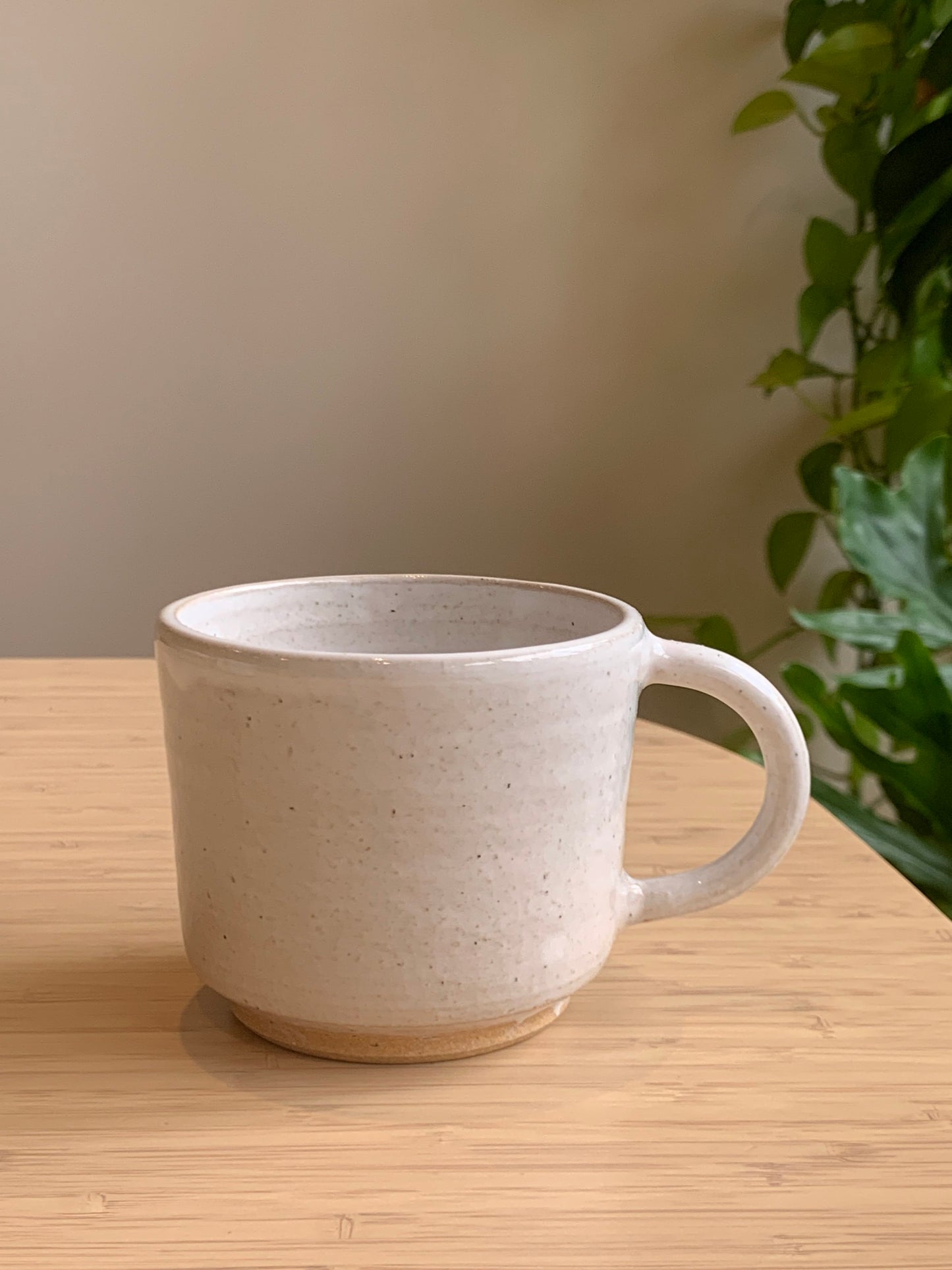 Warm Speckled handmade mug with white glaze on toasty clay. Adele Macer Ceramics. 